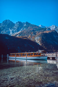 Scenic view of mountains against clear blue sky