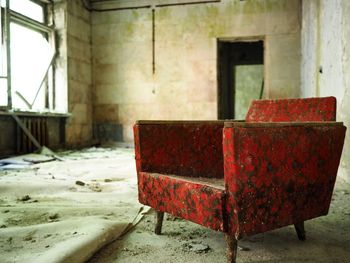 Empty chair in abandoned building