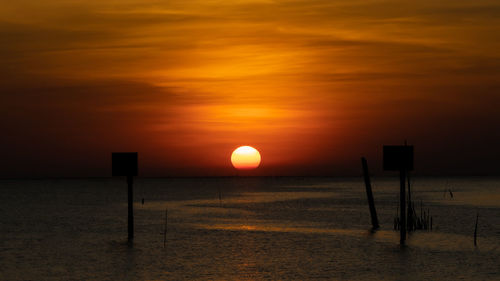 Scenic view of sunset over land