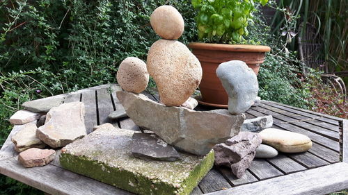 Stone sculpture on rock in garden