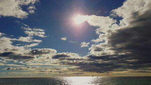 View of calm sea against cloudy sky