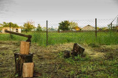 Wooden post in field