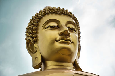 Low angle view of statue against sky