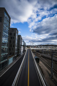 Highway in city against sky