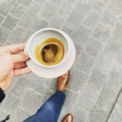 High angle view of coffee cup on floor