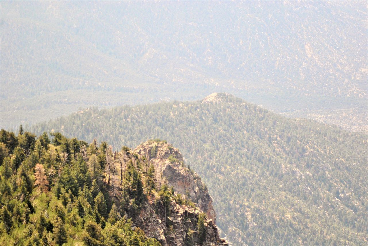 HIGH ANGLE VIEW OF LANDSCAPE AGAINST MOUNTAINS