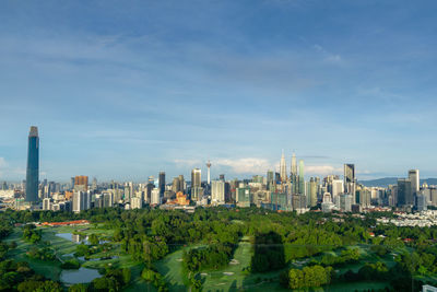 Modern buildings in city against sky