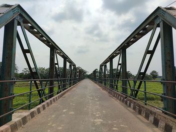 View of footbridge against sky