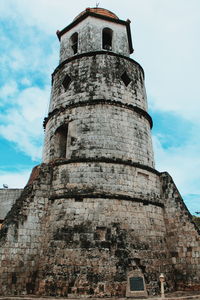 Low angle view of clock tower against sky