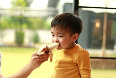 Portrait of boy eating food
