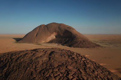 Scenic view of desert against clear sky