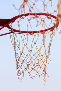 Low angle view of basketball hoop against sky