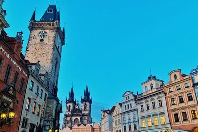 Low angle view of buildings against blue sky