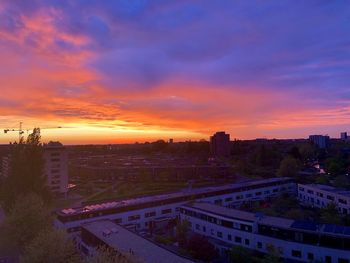 High angle view of buildings against sky during sunset