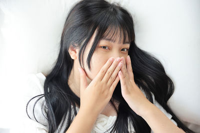 Close-up of young woman looking away