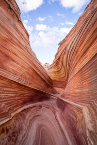 Low angle view of rock formation against sky