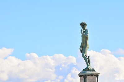 Low angle view of statue against cloudy sky