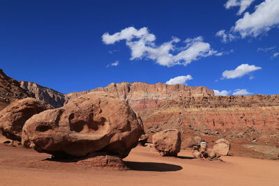 Scenic view of sand dunes against sky