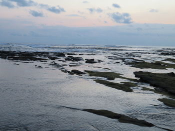 Scenic view of sea against sky during sunset