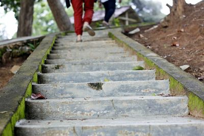 Low section of people walking on steps