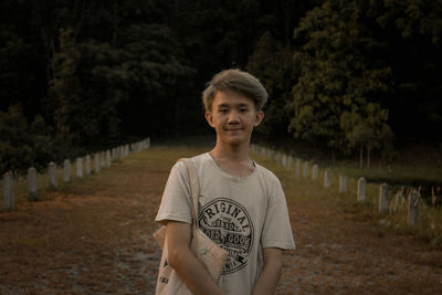 Portrait of smiling man standing on land