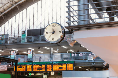 Low angle view of illuminated clock on train station