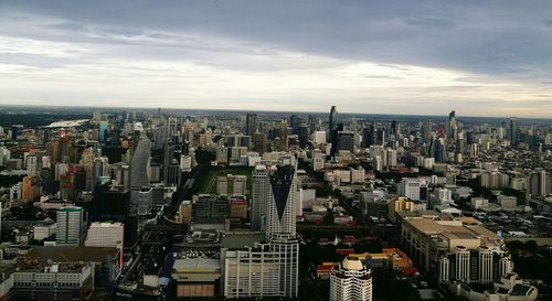 High angle view of modern buildings in city against sky