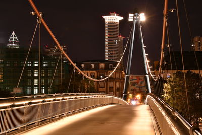 Illuminated suspension bridge at night