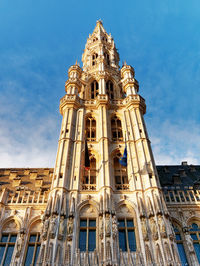 Low angle view of building against blue sky