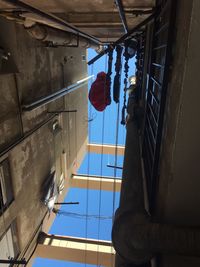 Low angle view of clothes drying against sky