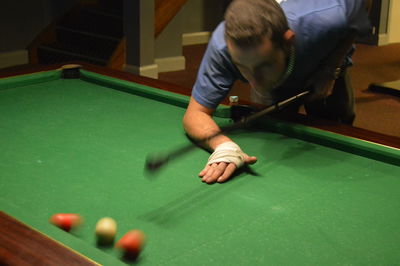 Young man playing snooker