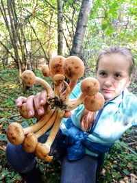 High angle view of children and mushrooms in park