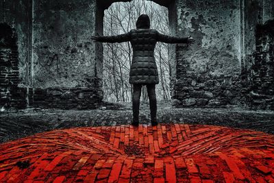 Woman standing by railing