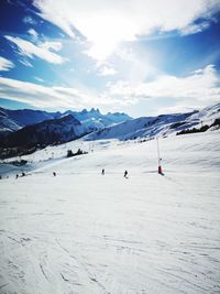 Scenic view of snowcapped mountains against sky