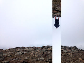 Low angle view of woman on mountain