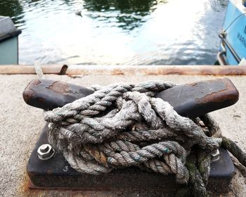 Close-up of rope tied on pier