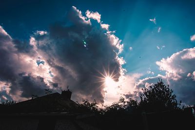 Low angle view of silhouette trees against sky during sunset