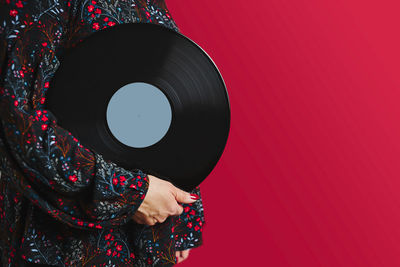 Woman holding vinyl record. music passion. listening to music from analog record. playing music. dj