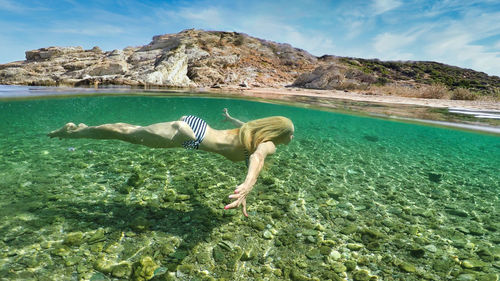 Woman swimming in sea