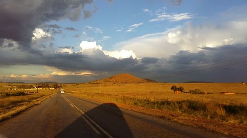 Road passing through field