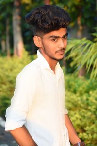 Portrait of young man standing outdoors