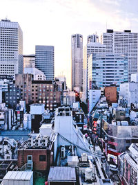 High angle view of buildings in city against sky