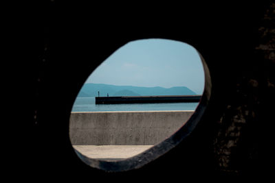 Scenic view of sea seen through window