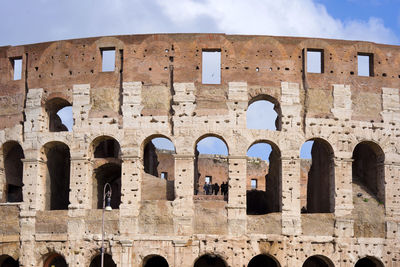 Low angle view of old ruins against sky