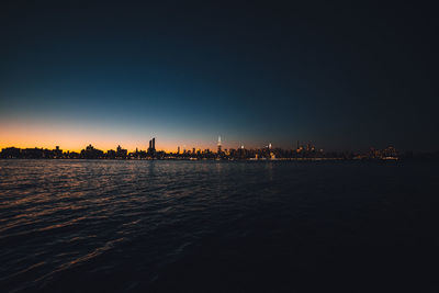 Illuminated cityscape at night