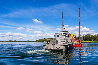 Boat in sea against sky