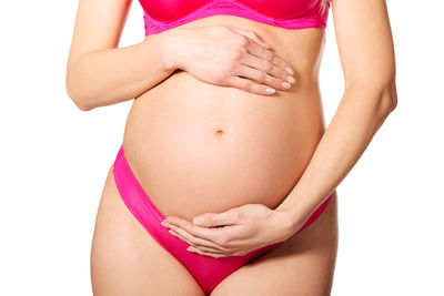 Midsection of woman against white background