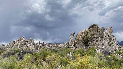 Low angle view of rocks against sky