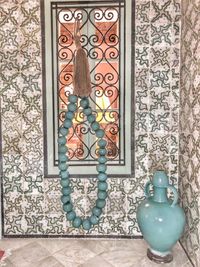 Ornate window on wooden floor in building
