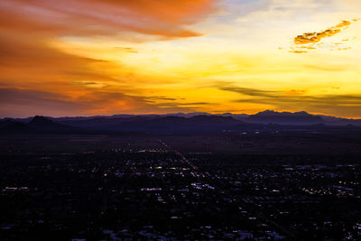 Scenic view of silhouette mountains against sky at sunset